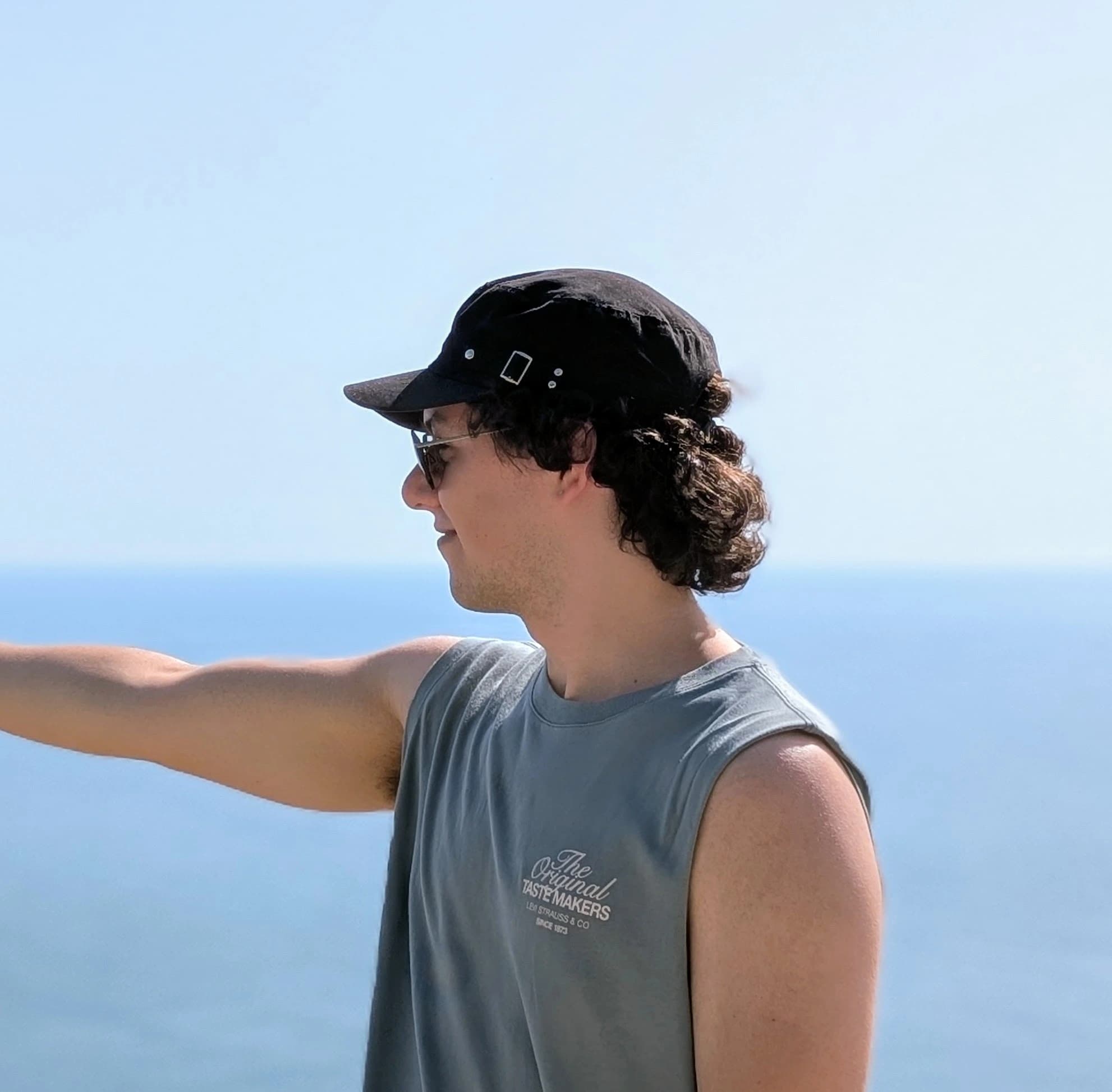 A picture of me pointing at the sea.